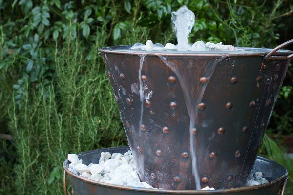 whiskey barrel water feature, ponds water features, repurposing upcycling