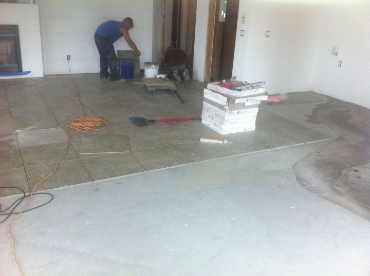 flooring pool room transformation, The installation of ceramic tile in the hall