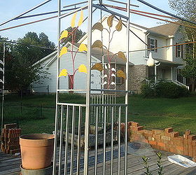 painted books under a metal gazebo decoration idea, outdoor living, patio, repurposing upcycling