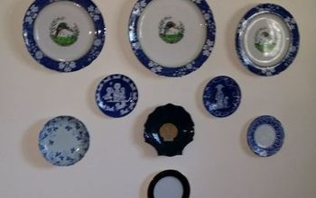 blue and white yard sale plate wall