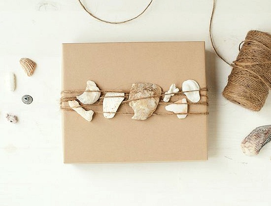 simple gift wrapping ideas with shells pine cones greenery, christmas decorations, seasonal holiday decor, Shell fragments slipped under twine