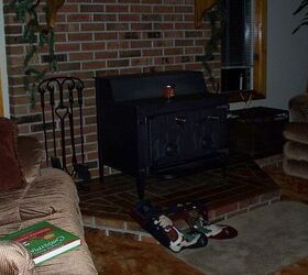 would it be safe to hang a tv over this wood burning stove, appliances