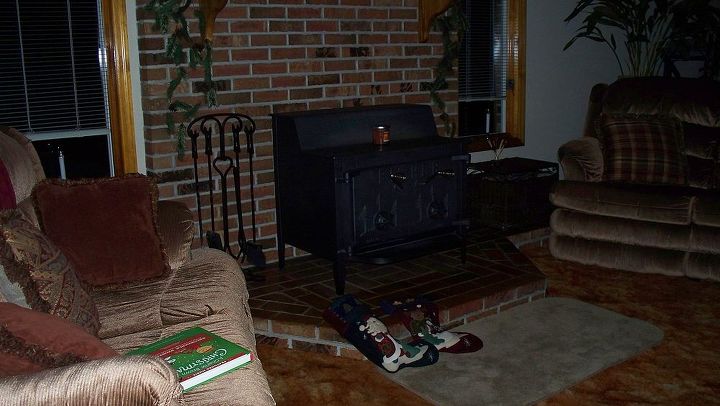 would it be safe to hang a tv over this wood burning stove, appliances