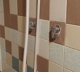can shower stall plumbing be inside the shower instead of through wall, The shower knobs themselves don t leak into the shower they leak behind the tile and in the cement block Aren t they ugly