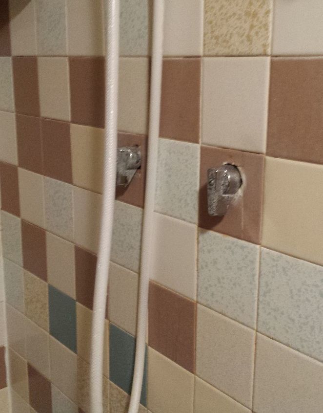 can shower stall plumbing be inside the shower instead of through wall, The shower knobs themselves don t leak into the shower they leak behind the tile and in the cement block Aren t they ugly