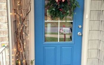 Ideas para puertas de Navidad: Bufandas para puertas y ramas iluminadas