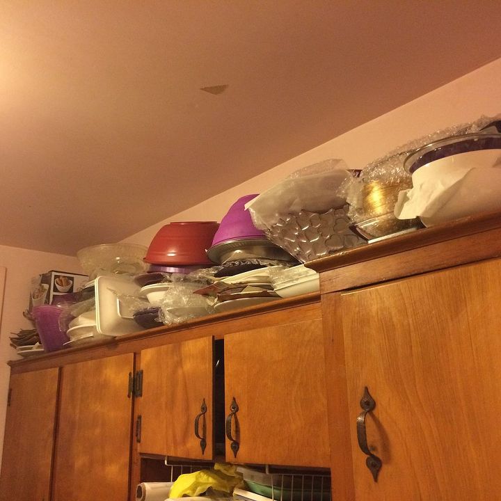 i have open shelves above my cabinets any ideas how to cover them up, this is the other side of the room with the servers on top of the cabinets