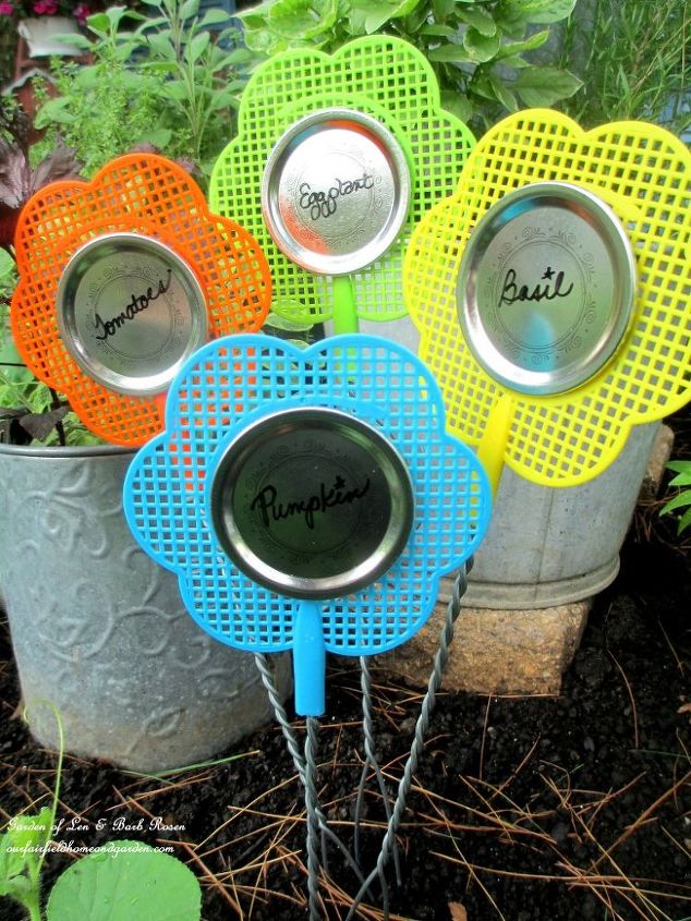 kitschy kitchen garden accents from dollar store finds, container gardening, crafts, gardening, repurposing upcycling, Flyswatters and canning lids Plant Labels