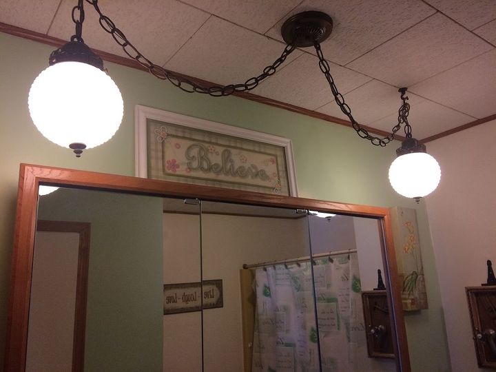 repurposing ideas for medicine cabinet and light fixture, I would love to do something unique with this light fixture so that I don t have to replace it
