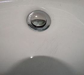 Black scratch marks on sink