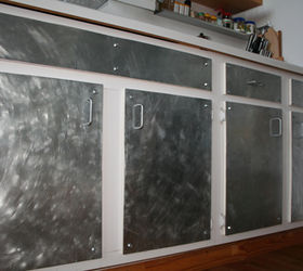 paint or new hardware to get industrial look in kitchen, kitchen cabinets, kitchen design, painting, Is this ugly I saw this online somewhere what do you all think It s galvanized sheets ontop of exsisting cabinet doors