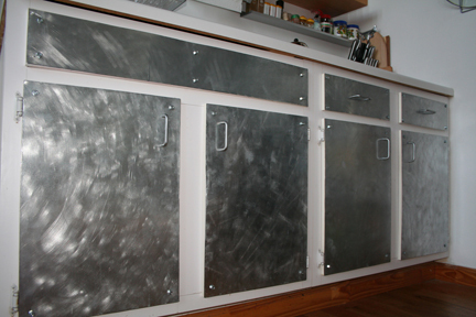 paint or new hardware to get industrial look in kitchen, kitchen cabinets, kitchen design, painting, Is this ugly I saw this online somewhere what do you all think It s galvanized sheets ontop of exsisting cabinet doors