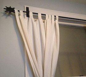 curtain placement previous owner screwed brackets into window trim