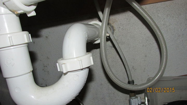 my kitchen sink sprayer hose wants to get hung up on the drain trap