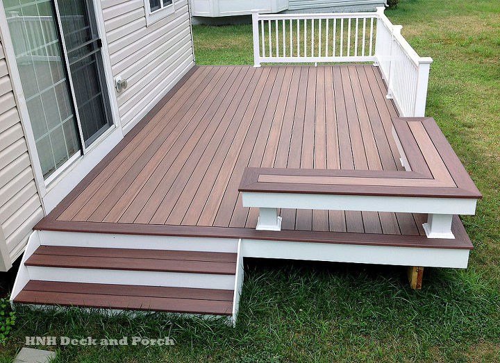 low maintenance decks, decks, outdoor furniture, outdoor living, Vinyl patio deck using Wolf PVC Decking with amberwood flooring and rosewood border and Longevity white PVC railing