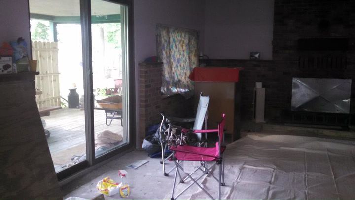 q does anyone have any ideas what to do with this fireplace, fireplaces mantels, home improvement, living room ideas, this is the sliding glass door to the left of the fireplace that goes out to the lake sorry I d stayed there while things were being worked on messy windows on each side of the sliding glass door