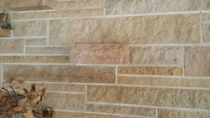 updating a stone fireplace wall, one of 2 protruding outlets for additional heat to the room