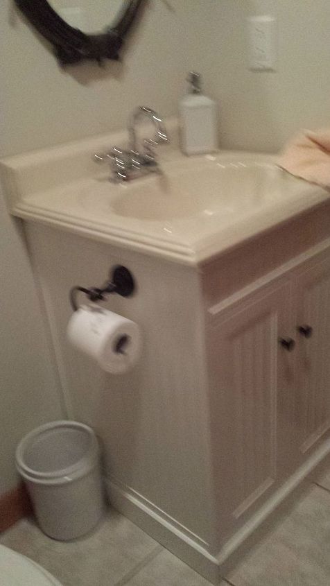 q how can this small powder room be updated, bathroom ideas, home improvement, small bathroom ideas, The vanity is white beadboard with a biege white top The chrome faucet will not be replaced I recently replaced the chrome accessories with oil rubbed