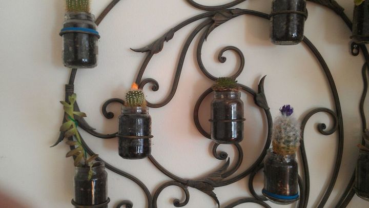 recycled wrought iron candle holder turned into planter
