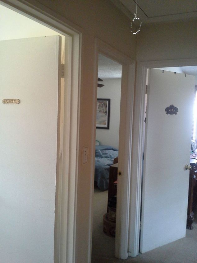 q need to paint a 10 ft x 3 ft dank dark hallway color sugesstions, foyer, paint colors, painting, Still to the left at a sharper angle just past the linen closet is a small 3 inch space between the two bedroom doors The bedroom door at the end of the hallway has no spacing between next bedroom door just framing