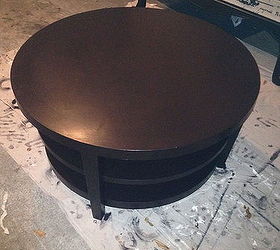 round coffee table turns into tufted ottoman