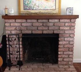 easy fireplace makeover whitewash the brick, concrete masonry, fireplaces mantels, painting, Our fireplace before