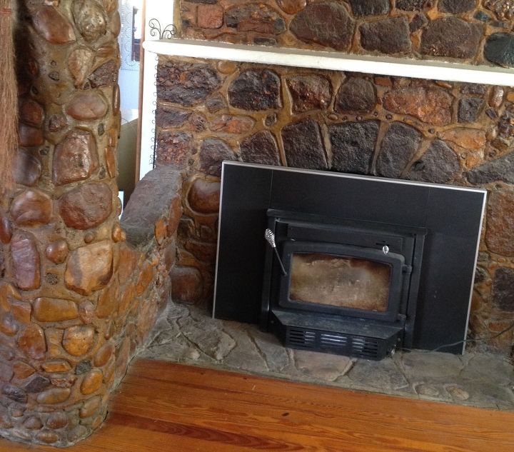 help old stain has yellowed natural stone on my fireplace, The stone below the stove is not stained The stained stone has that ugly orange hue to it Is there any way to cover over it or remove it altogether