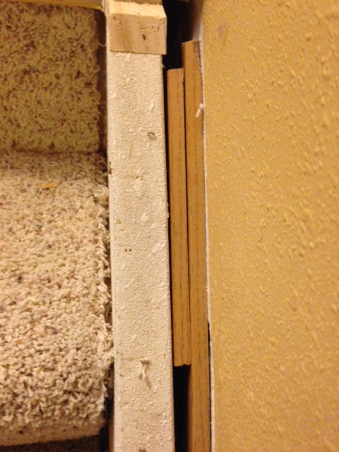 skirt board on stairs all screwed up under the carpeting