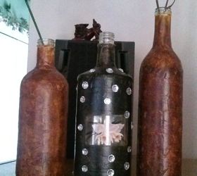 leather look bottle with masking tape, liquor bottle in middle
