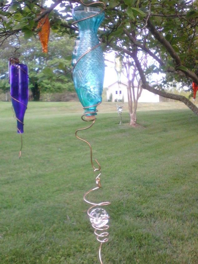 bottle tree of different shapes and colors, outdoor living, repurposing upcycling