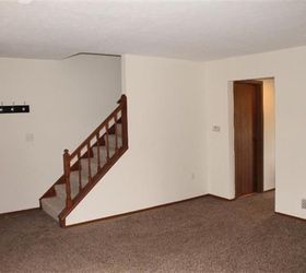 q how to decorate around fireplace, fireplaces mantels, how to, This picture is the stairs to the left of the front door as you walk in The doorway goes to the half bath and kitchen and dining room