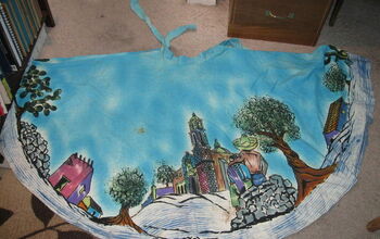 How do I remove old stains from vintage hand painted fabric?