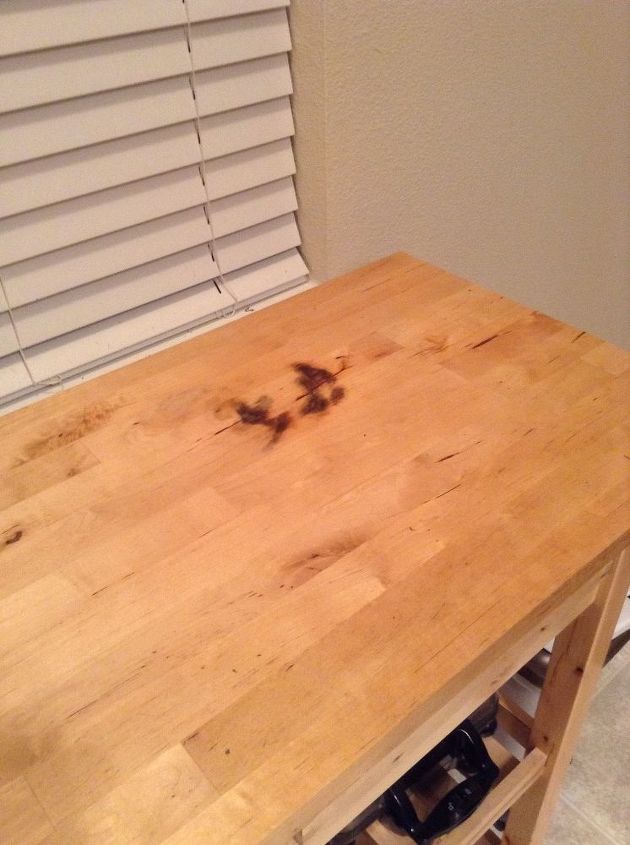 how do i remove a stain from wood counter top, I really don t want to have to stain the cart a darker color Help please