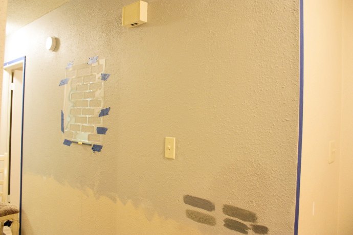 a diy stenciled brick hallway accent wall