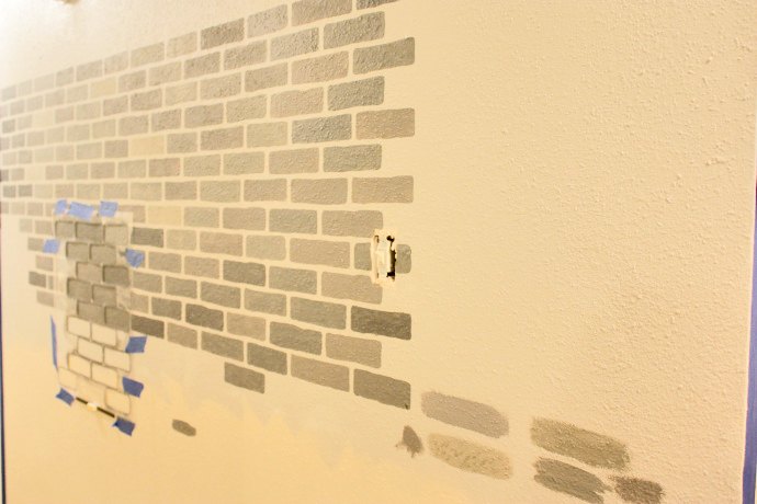a diy stenciled brick hallway accent wall