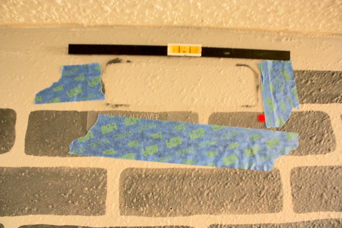 a diy stenciled brick hallway accent wall