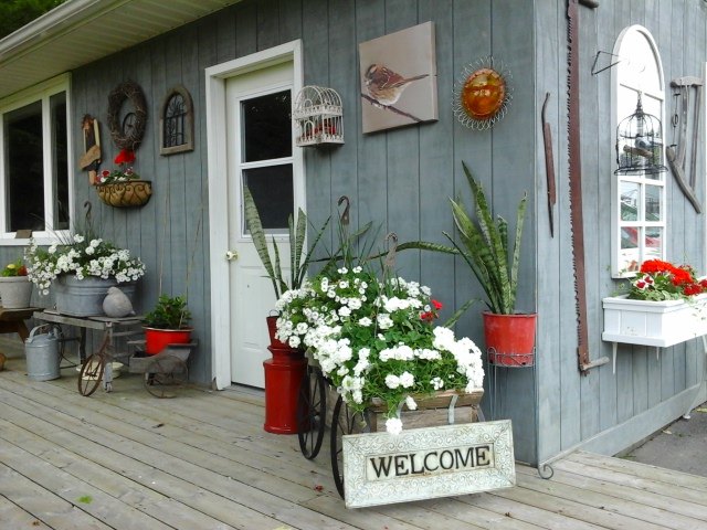 rustic flower displays along the workshop and backyard garden, container gardening, flowers, gardening, outdoor living, repurposing upcycling