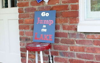  Placa pintada &quot;Vá pular no lago&quot;.