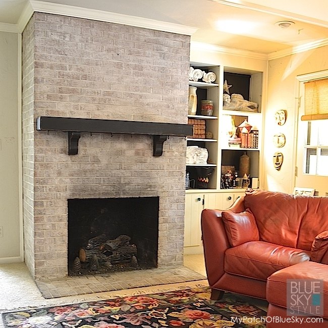 a dreary brick fireplace gets a new look using fusion mineral paint
