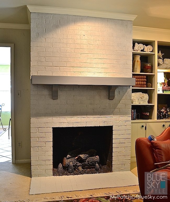 a dreary brick fireplace gets a new look using fusion mineral paint