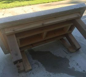 back yard coffee table top made of concrete with crushed wine bottles