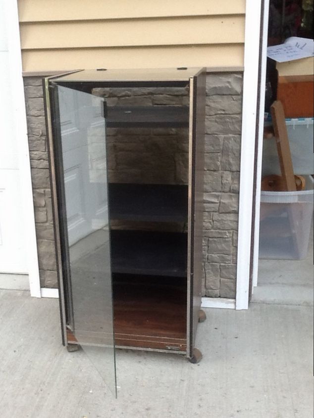 q how to repurpose a dated stereo glass cabinet, painted furniture, repurposing upcycling, It s just sitting around in the garage collecting dust and getting in the way Any ideas