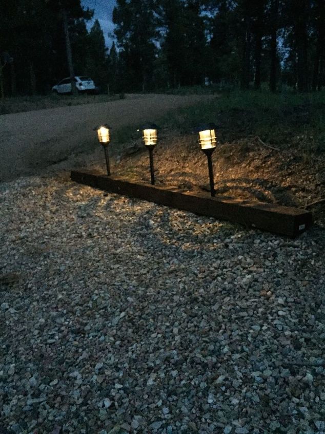 landscape timber to a lighted driveway, concrete masonry, outdoor living