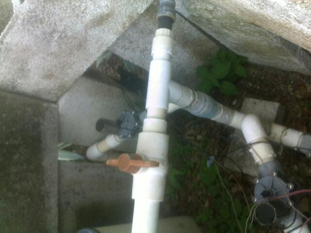 revamped the rain barrel sprinkler, gardening, outdoor living, plumbing, Here is a top view of the well system lots of pipes a few valves and wiring everywhere