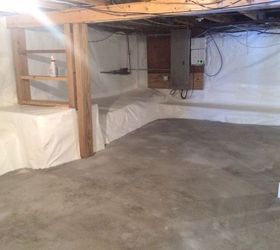 transforming a damp dark basement with a dirt floor now dry clean