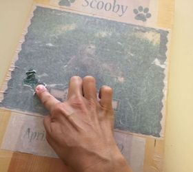diy pet memorial photo bench, decoupage, diy, how to, outdoor furniture, woodworking projects, Use your finger to gently rub away the paper