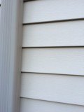 q paint color combo suggestions for curb appeal, concrete masonry, curb appeal, doors, paint colors, painting, A photo of the siding and a trim piece Faded for certain but not in the budget to replace or paint