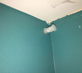 screwing in hooks with drywall anchors but hit a stud, The drywall anchor can only go about half as deep as it needs to go Please ignore our paint mistakes