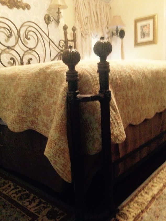 q suggestions on to update mediterranean bedroom furniture, bedroom ideas, painted furniture, There are iron posts like this on both of the bottom corners of the bed