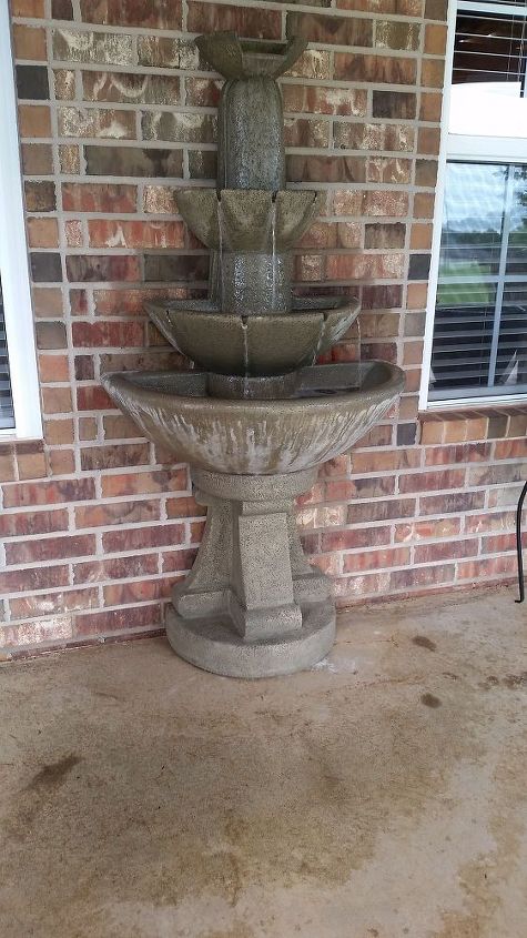 question about outdoor fountain causing a lot of overspray, pic showing where the floor is always wet in front of it